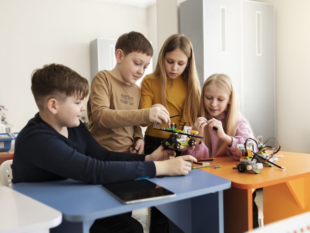 Vibrant Student Life and Extracurricular STEM Activities at Pointe Schools Students engaged in a hands-on STEM club activity, assembling a drone together at Pointe Schools.