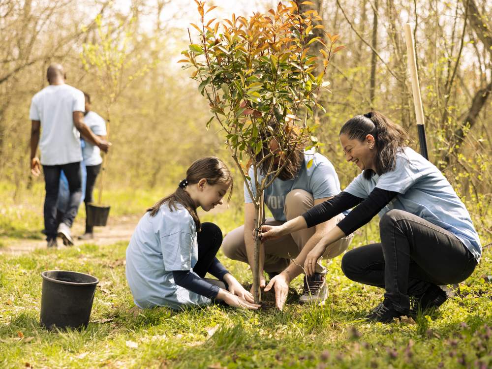 Community Engagement and Leadership at Pointe Schools A Pointe Schools student participating in a community service initiative by planting a tree with volunteers.